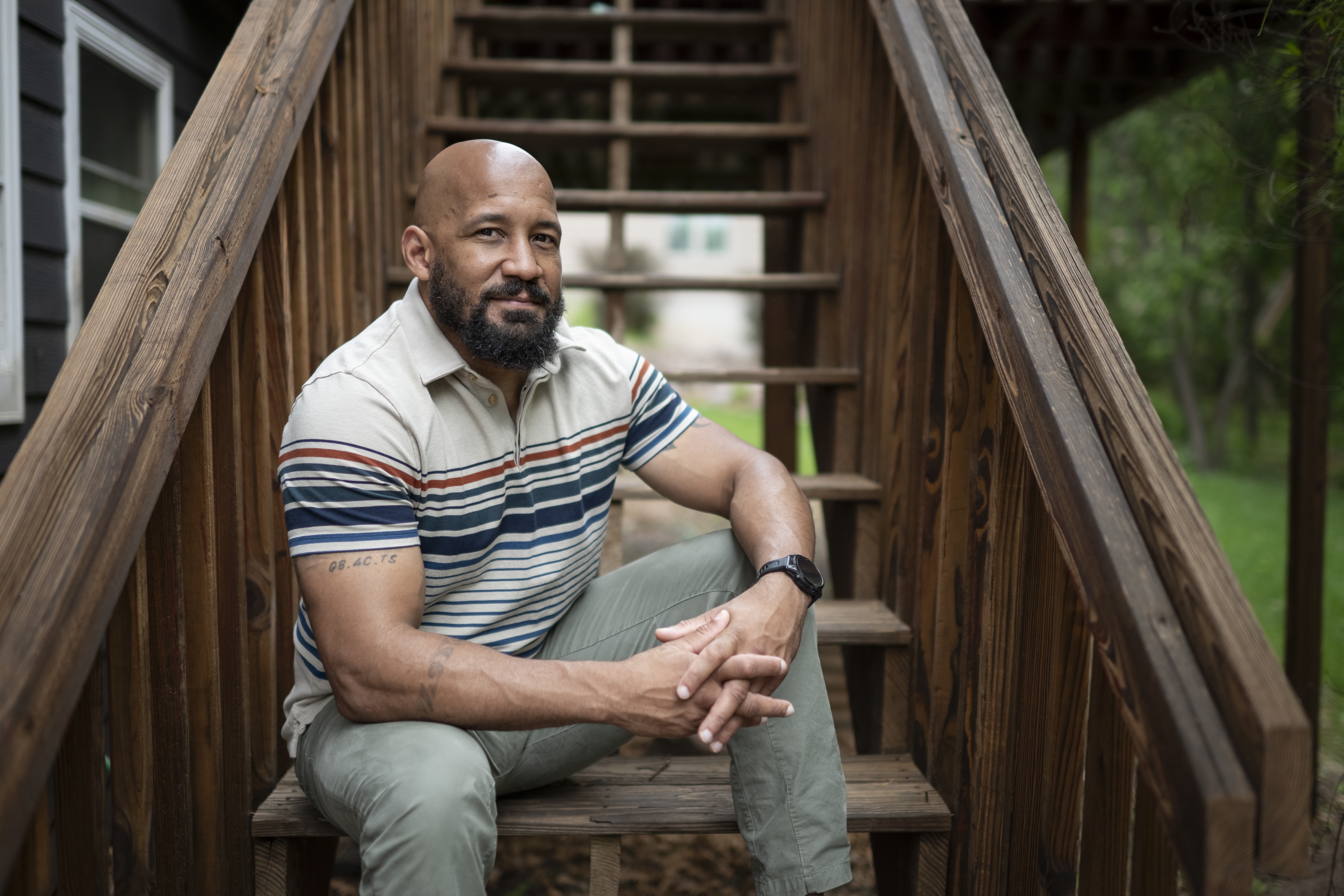 Dave Carlson, of Eau Claire, Wis., poses for a portrait outside his home on May 30. NPR Veterans Correspondent Quil Lawrence and Carlson began corresponding 10 years ago when Carlson, an Iraq vet, was incarcerated. Their conversations follow the evolution of Carlson